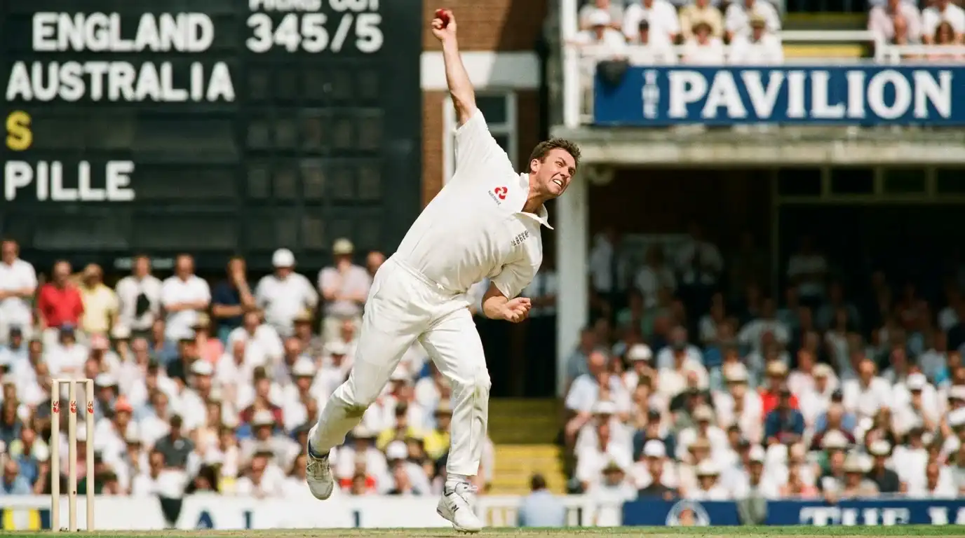 England Test bowler in delivery stride during an Ashes match at a packed English ground
