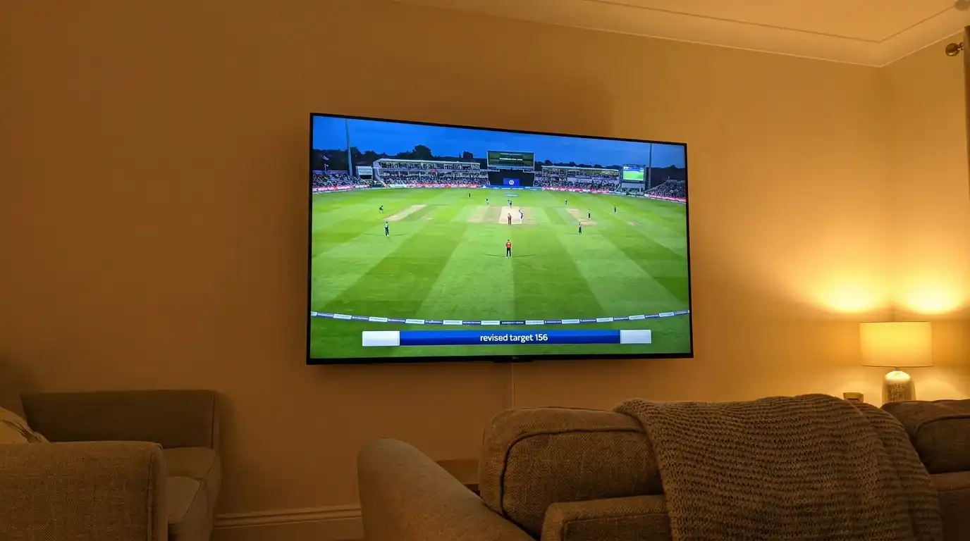 Broadcast graphic overlay showing the revised target after a rain delay during a one-day international shown on a UK living-room television
