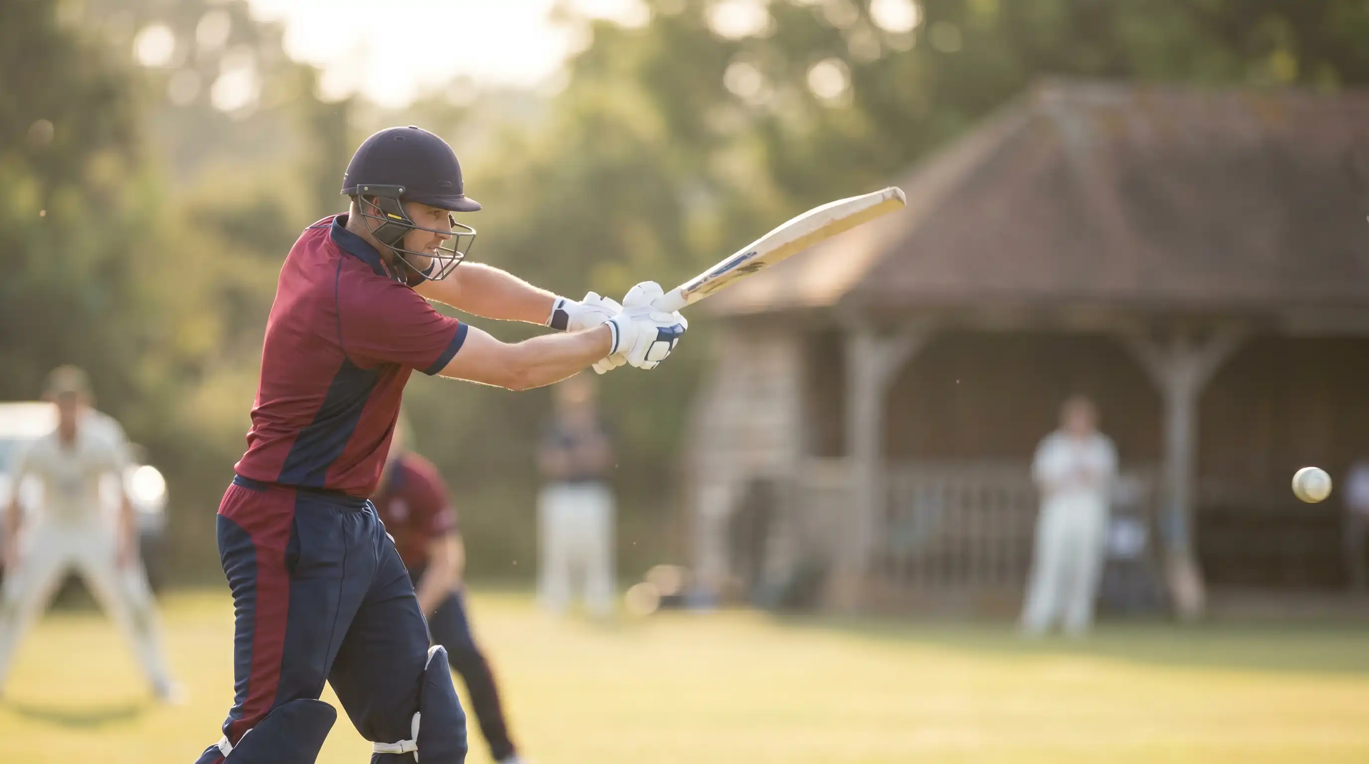 County cricketer playing a measured drive during the middle overs of a One-Day Cup innings at an English ground