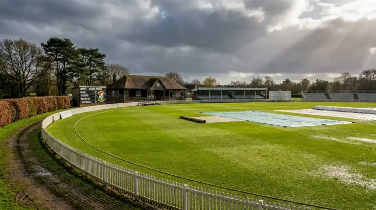 English county cricket ground in summer with empty pavilion and rolled square ready for a new match